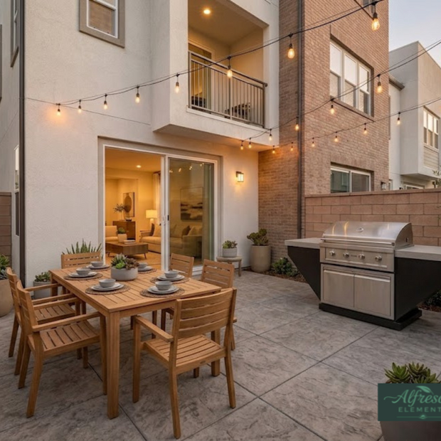 Outdoor patio with wooden dining table and chairs, grill, and string lights.