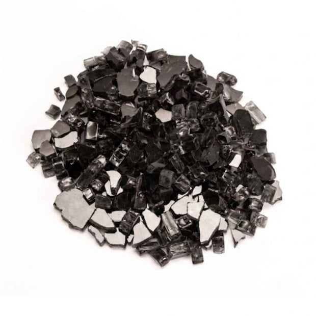 Small black metallic pieces of glass on a white background