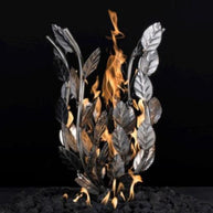 Decorative metal fire bowl with leaf design and flames on a black background