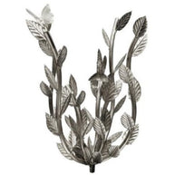 Decorative wall sconce with leaf and bird design on a white background