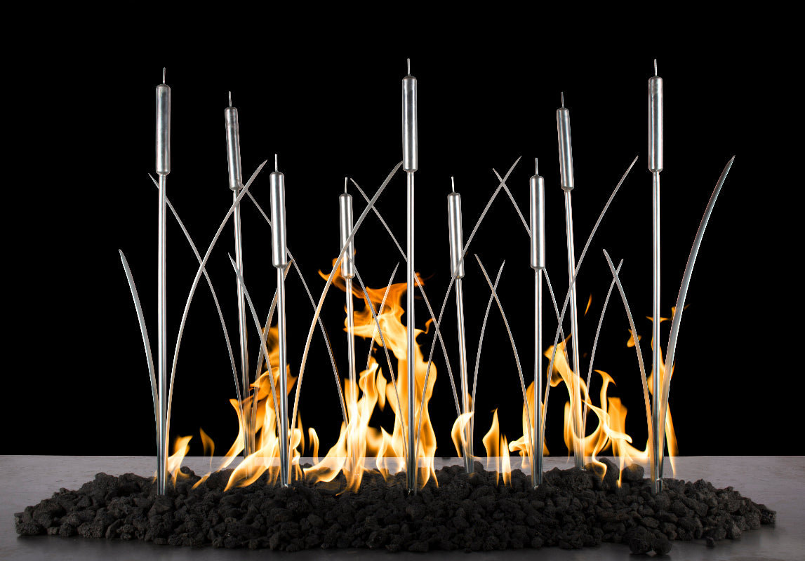 Modern fireplace with metal rods and flames against a black background