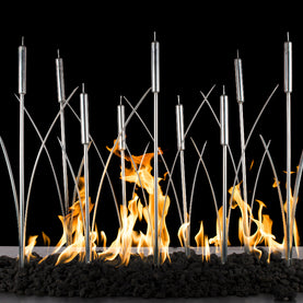 Modern fireplace with metal rods and flames against a black background