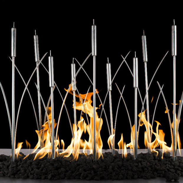 Modern fireplace with metal rods and flames against a black background