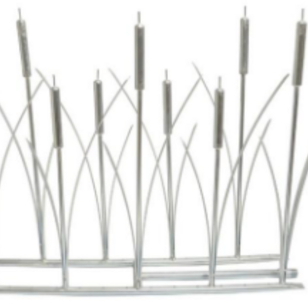 Decorative metal cat tails for a fireplace on a white background
