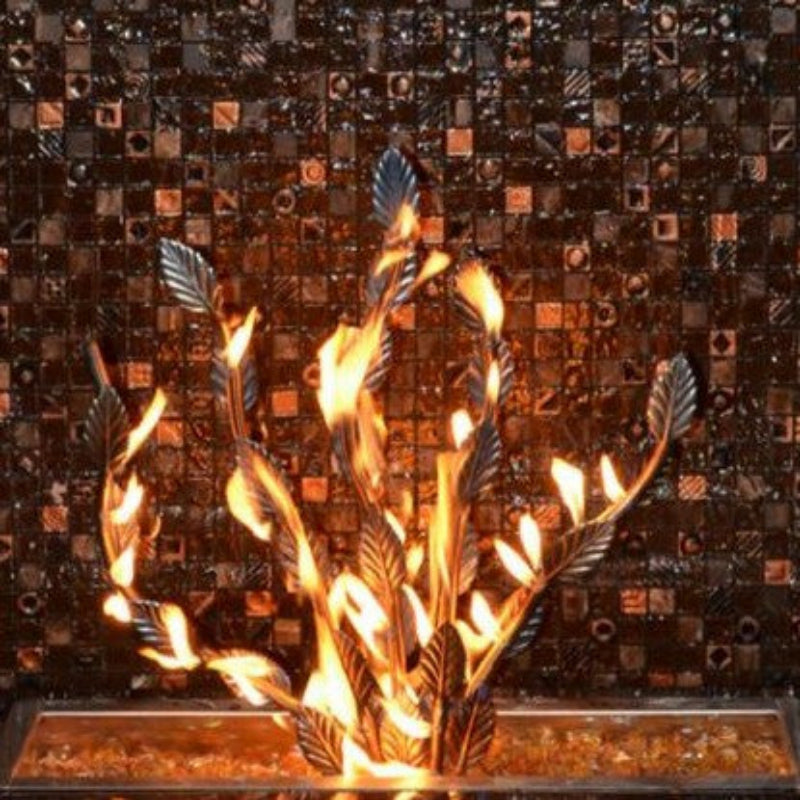 Decorative fireplace insert with flames against a mosaic tile wall.