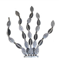 Decorative metal plant with leaf design on a white background