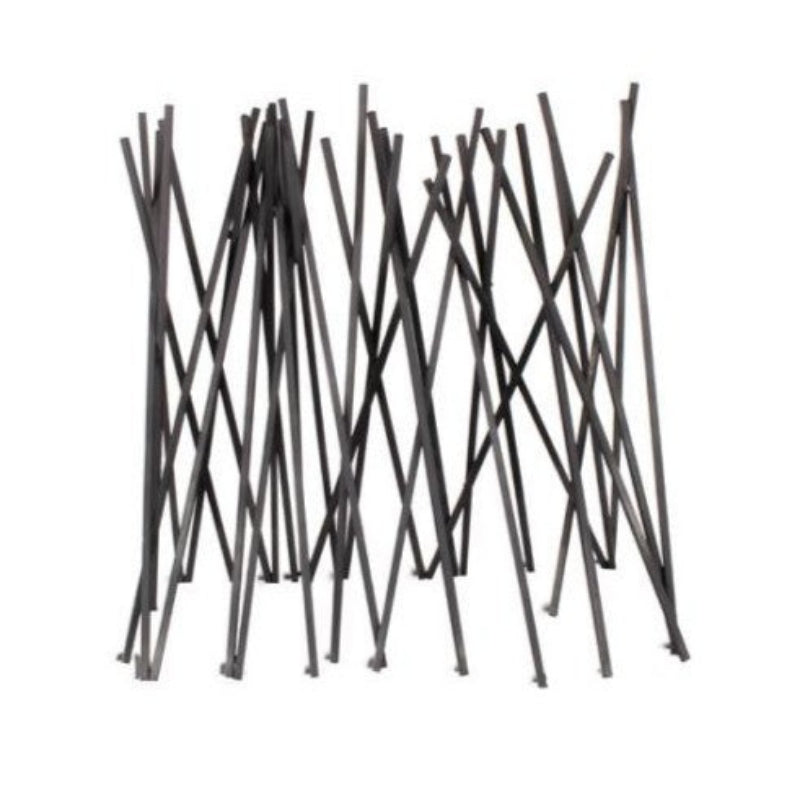 Black metal firewood holder with interwoven design on a white background