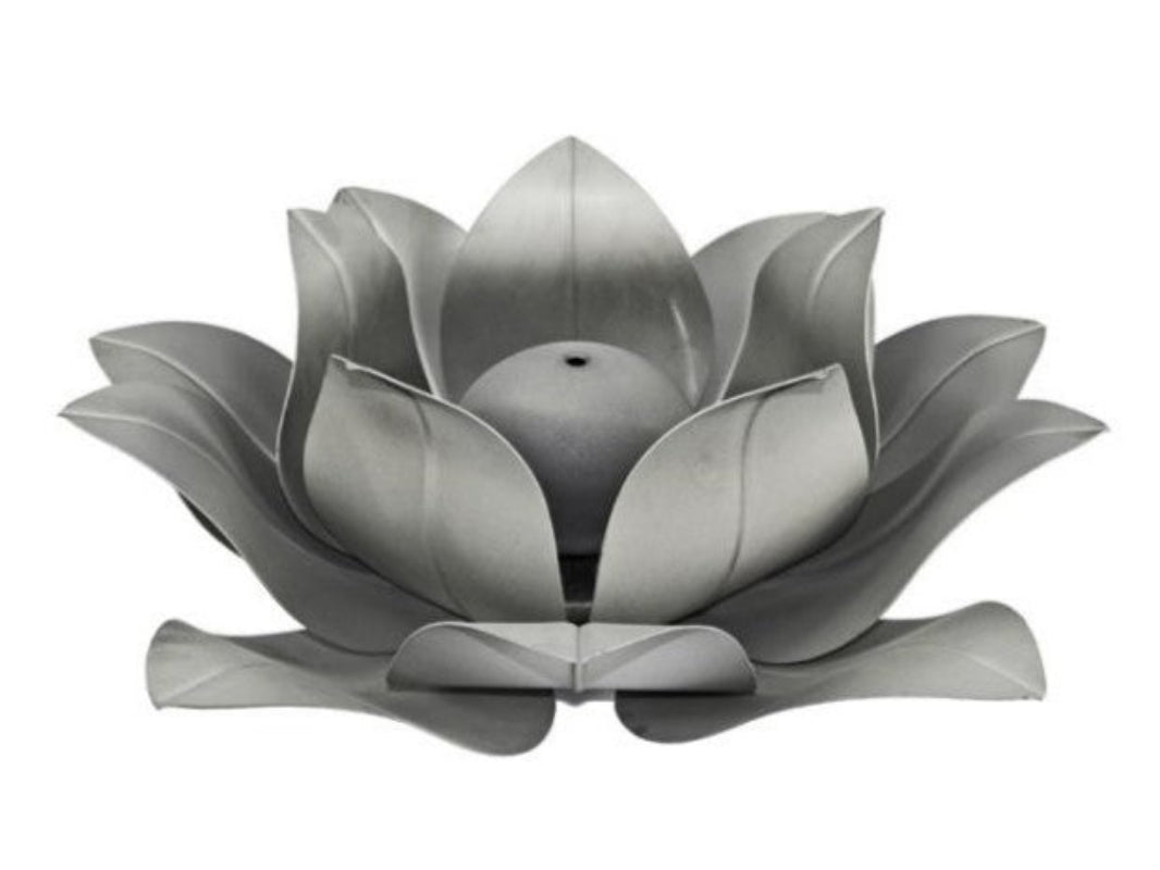 Silver lotus flower-shaped fire feature on a white background