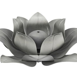 Silver lotus flower-shaped fire feature on a white background