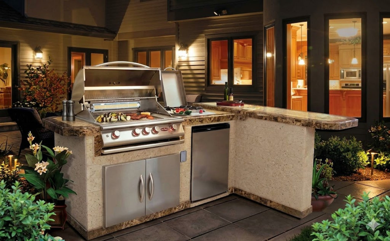 Outdoor kitchen with grill and island in a residential setting