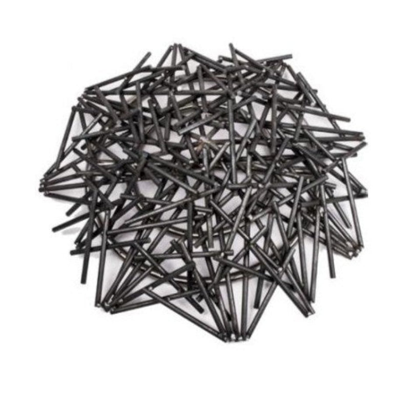 Pile of black metal stakes on a white background