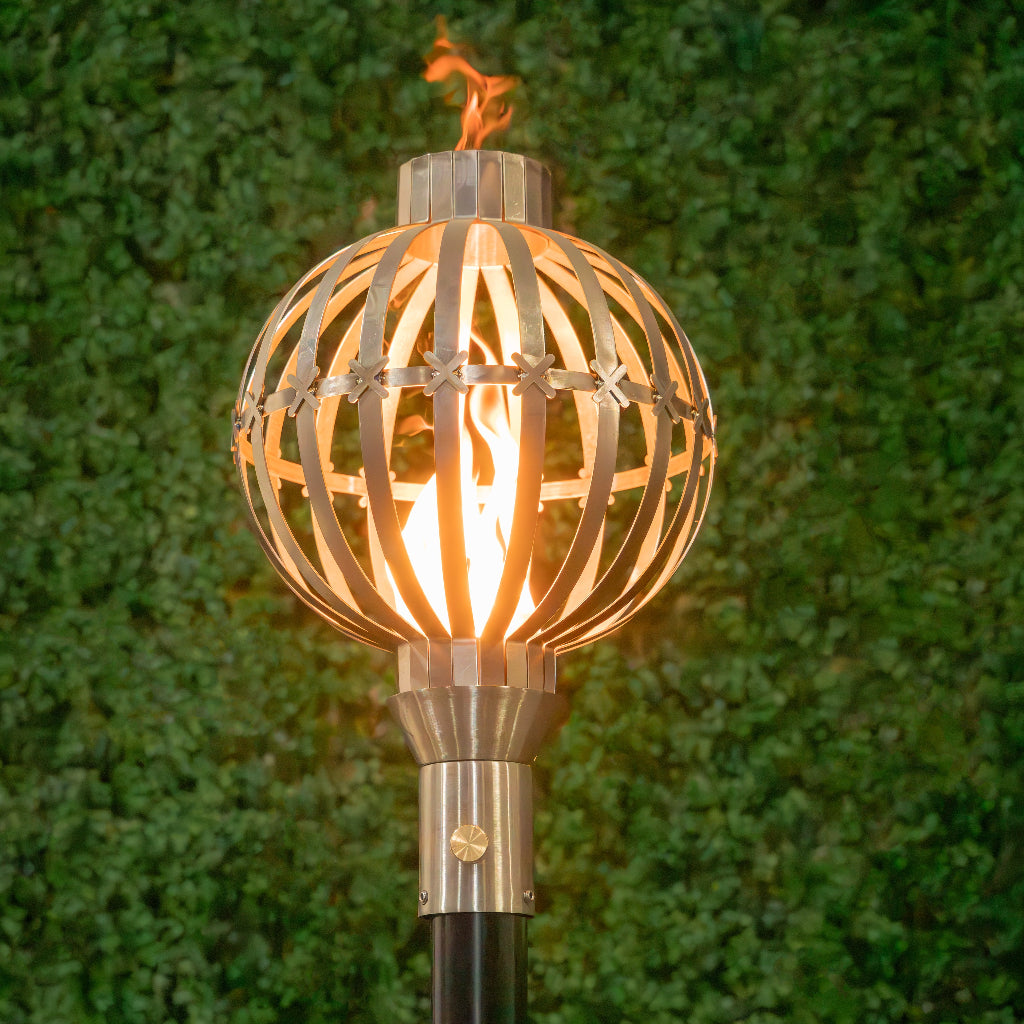 Globe-inspired 304 Stainless Steel torch head with 68-inch mounting post by The Outdoor Plus in garden setting