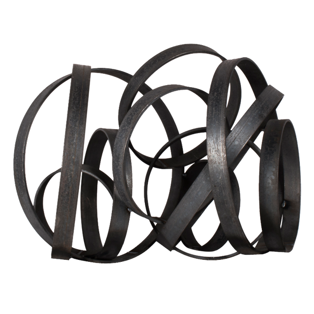 Black metal sculpture with intertwined loops on a white background