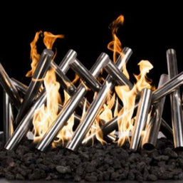 Metal fire pit logs with flames against a black background