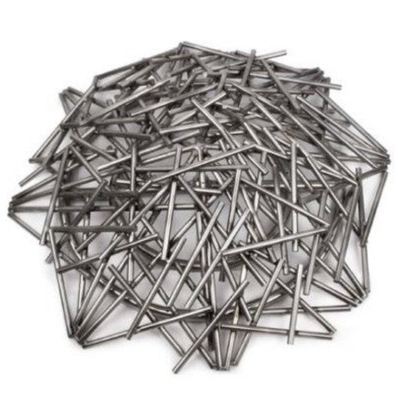 Pile of metal nails on a white background