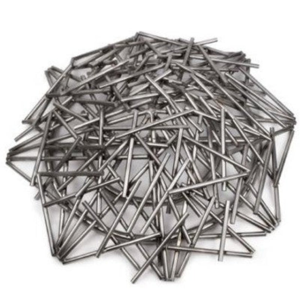 Pile of metal nails on a white background