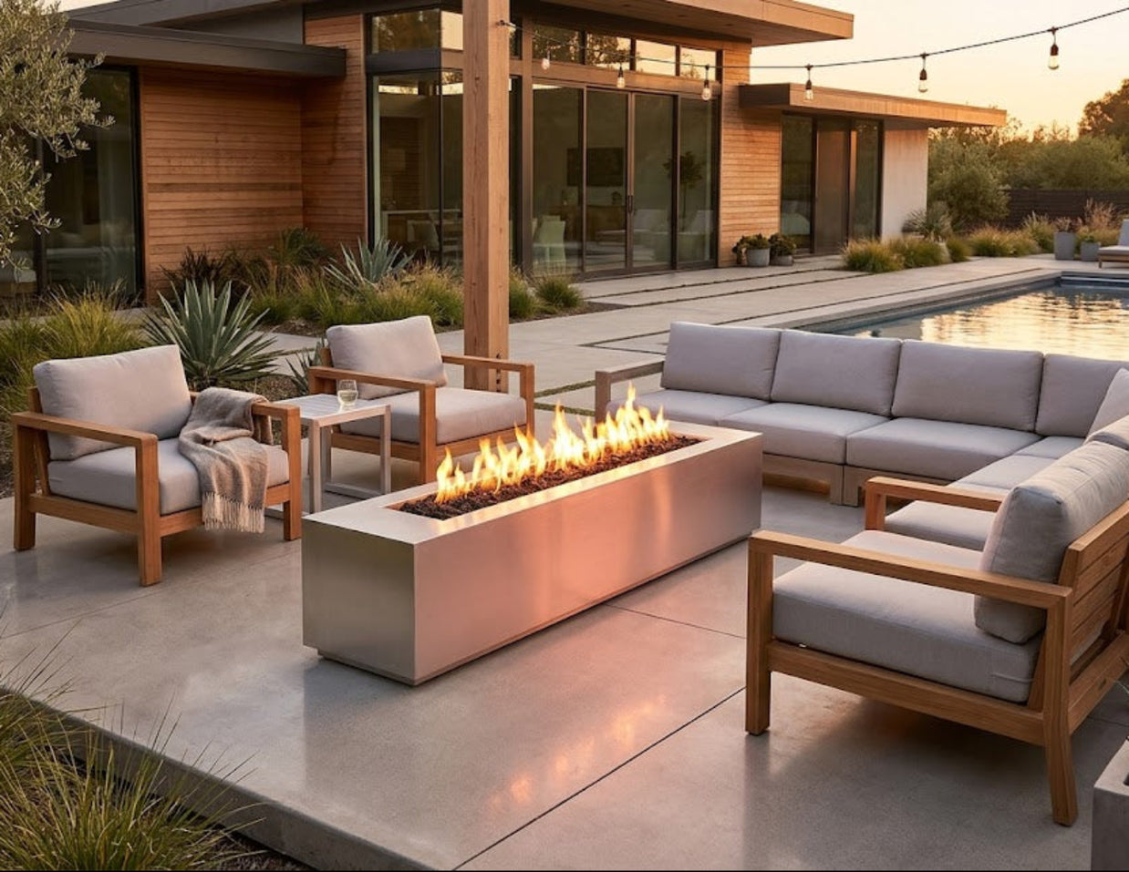 Outdoor patio with modern furniture and fire pit in a residential setting
