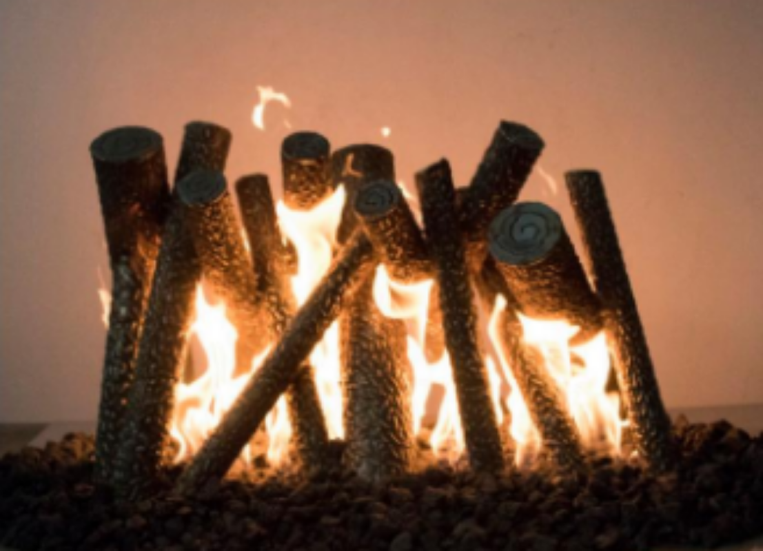 Fireplace with logs burning against a warm background