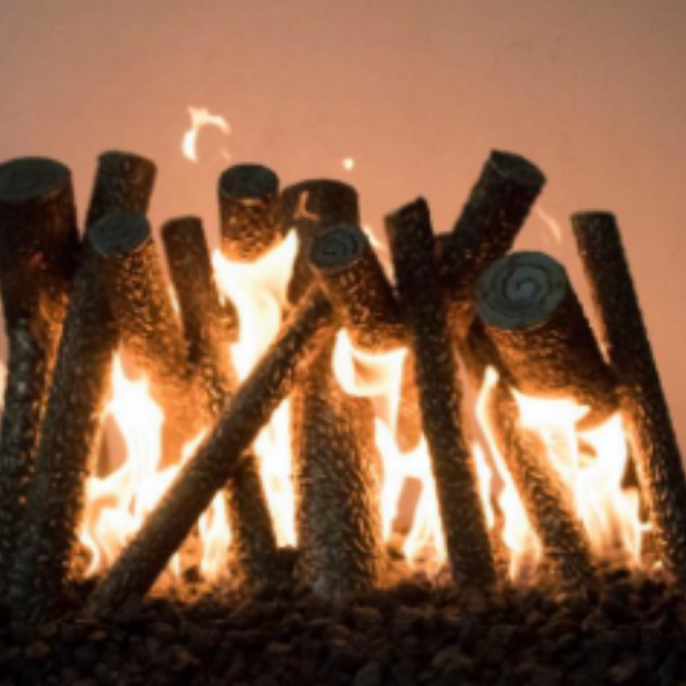 Fireplace with logs burning against a warm background