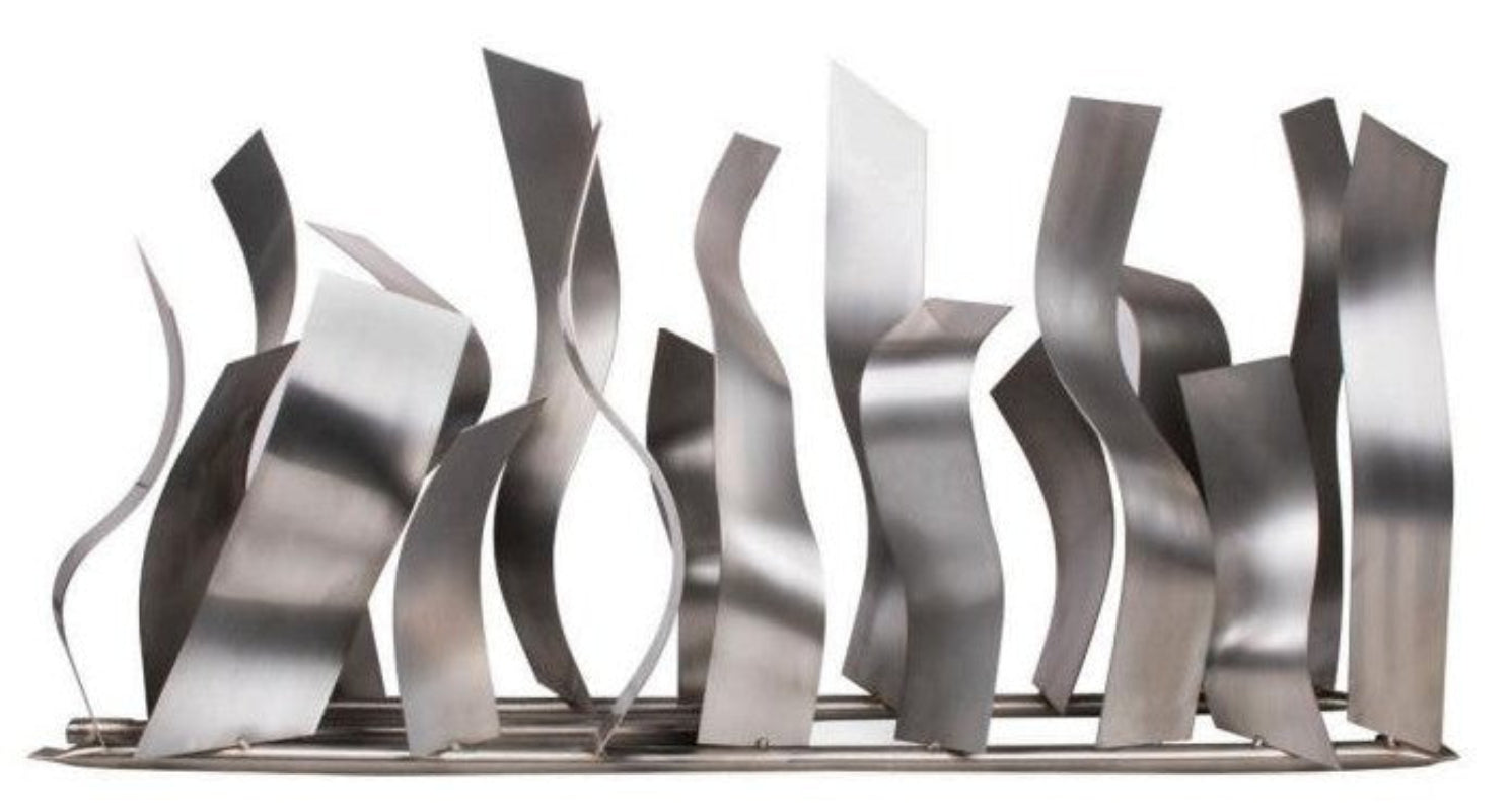Metallic abstract sculpture with wavy patterns on a white background