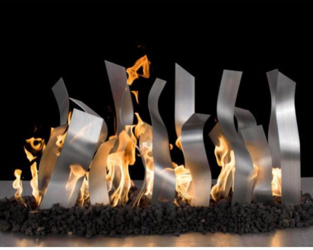 Modern metal fireplace insert with flames against a black background