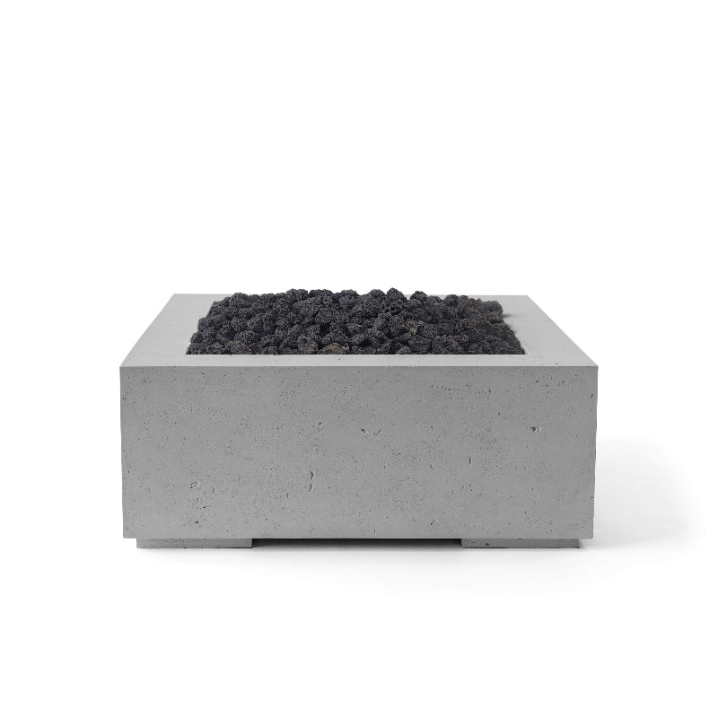 Square concrete fire pit with lava rock on a white background
