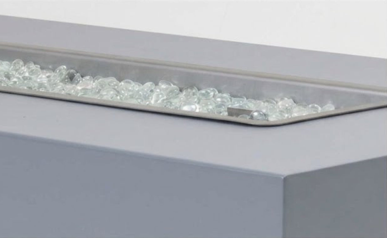 Close-up of a fire pit with glass beads on a white background