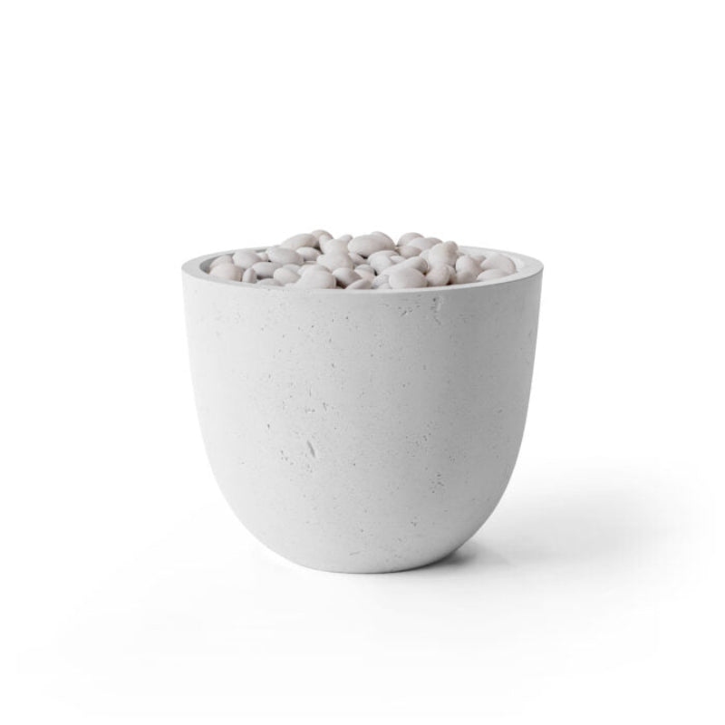 White textured bowl filled with small stones on a white background
